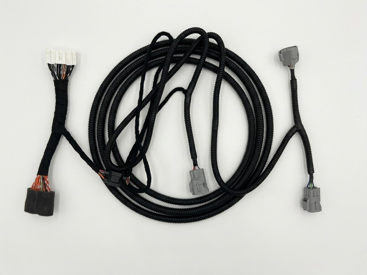 Wire harness with grey sealed connectors and corrugated conduit